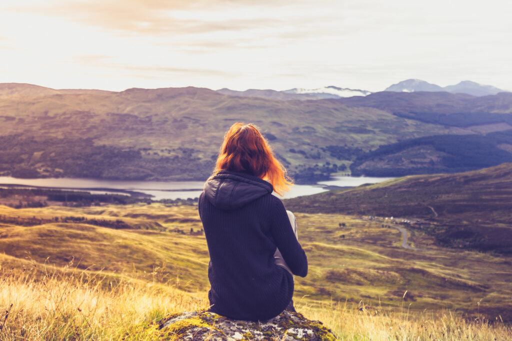 Woman looking at highland skyline