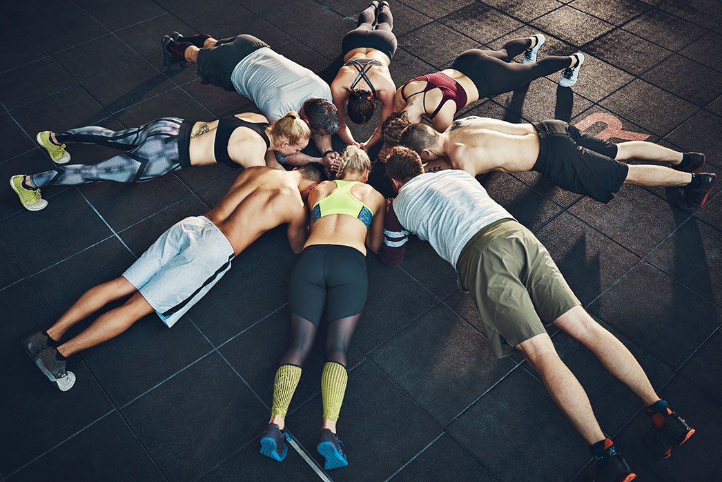 Group of people planking during a workout