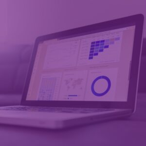 Laptop open on analysis page showing marketing trends with purple overlay